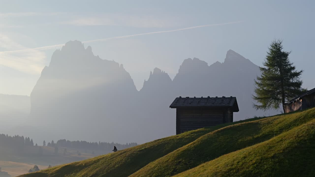 Sunrise in the Alps: Secluded Cabin and Majestic Mountains