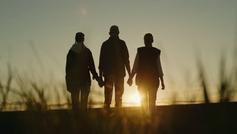 family walk at sunset