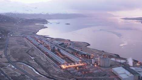 alcoa fjardaál aluminium smelter facility factory in iceland during sunrise