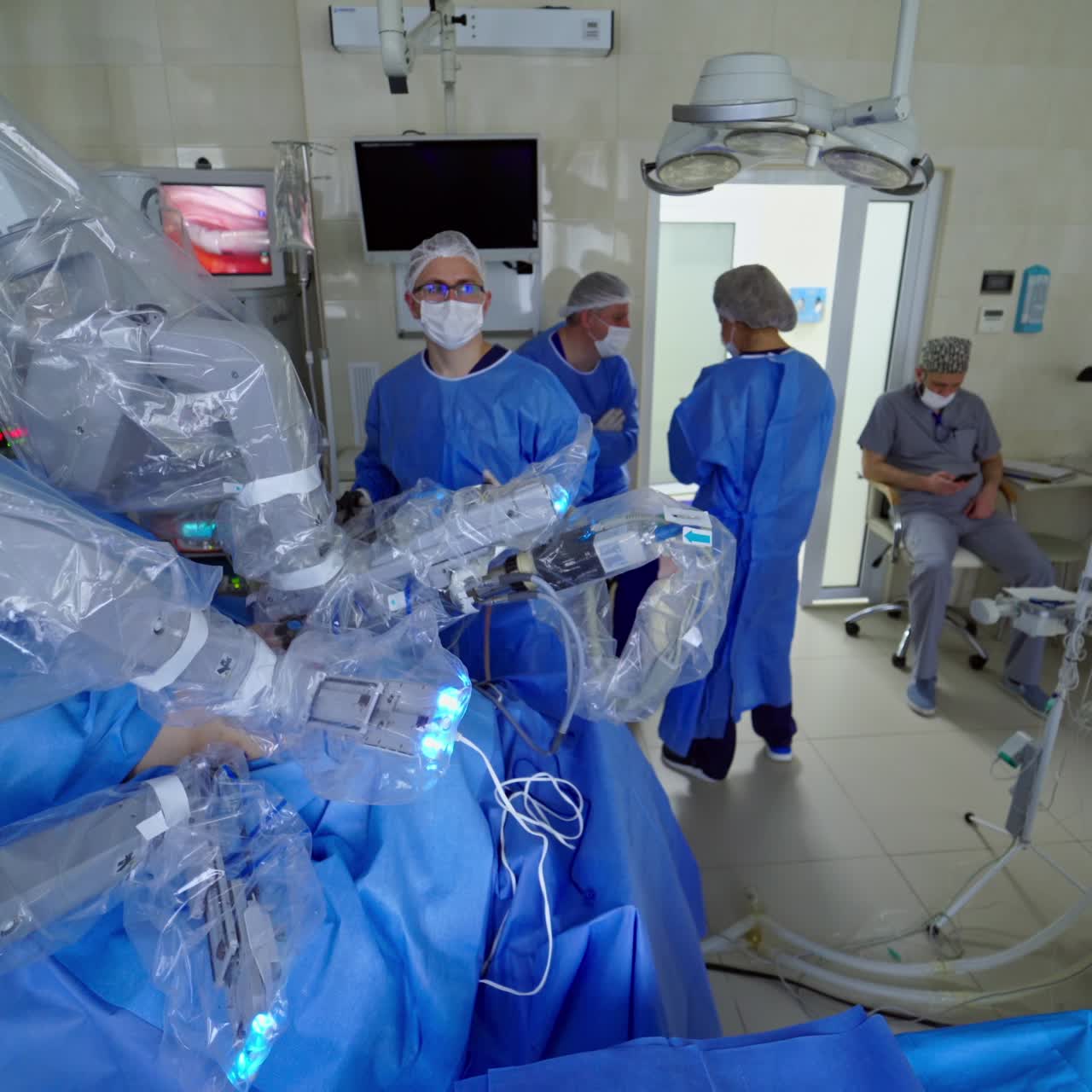 Team surgeon at work in operating room. Modern equipment in operating room. Surgical system da Vinci