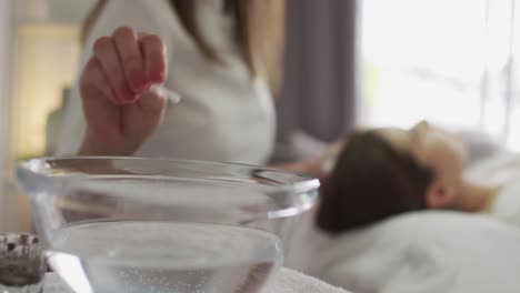 caucasian woman lying down having her eyebrows dyed