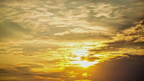 Timelapse-shot-of-sun-beams-shining-through-moving-dramatic-white-clouds