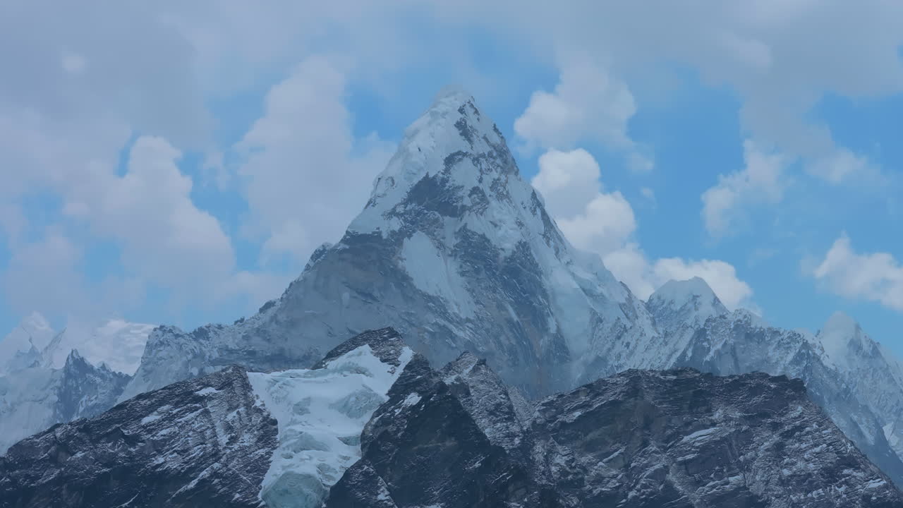Ama Dablam mountain seen from Kala Patthar, Everest Base Camp Nepal. Majestic peak under shifting skies, cloudy weather, and high-altitude Himalayan scenery reveal climate change conservation, peace