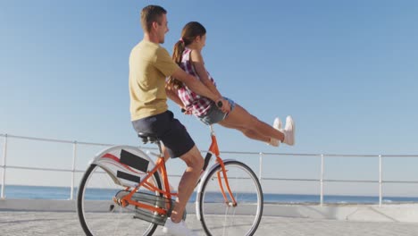 young adult couple having fun at the seaside