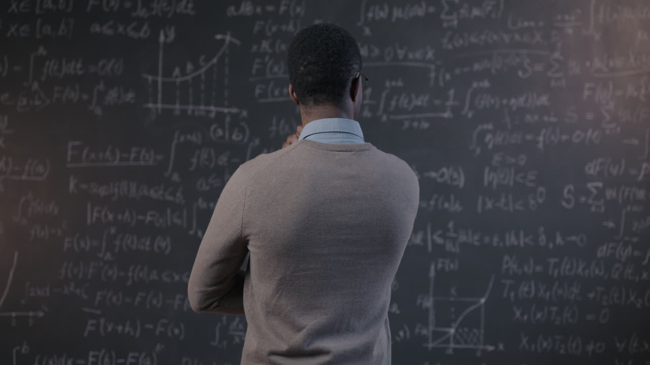 Student Contemplating Math Equations on a Chalkboard