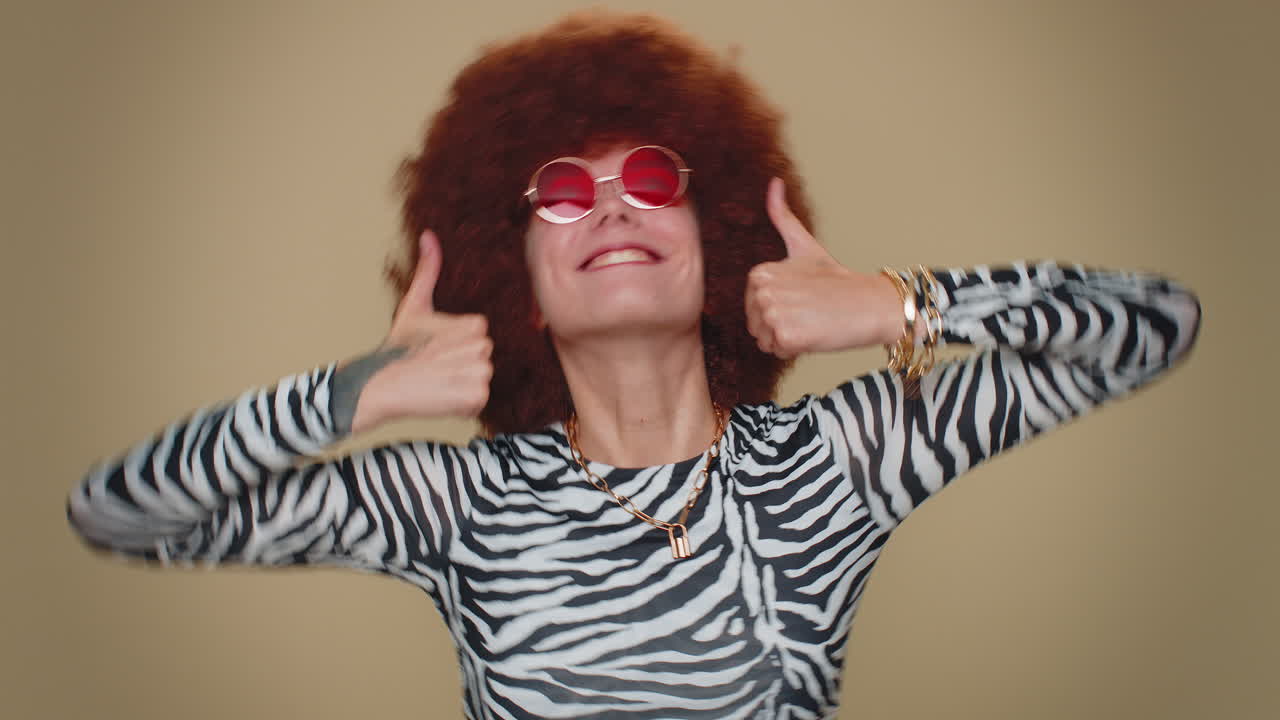 Woman raises thumbs up agrees or gives positive reply recommends advertisement likes good, approve