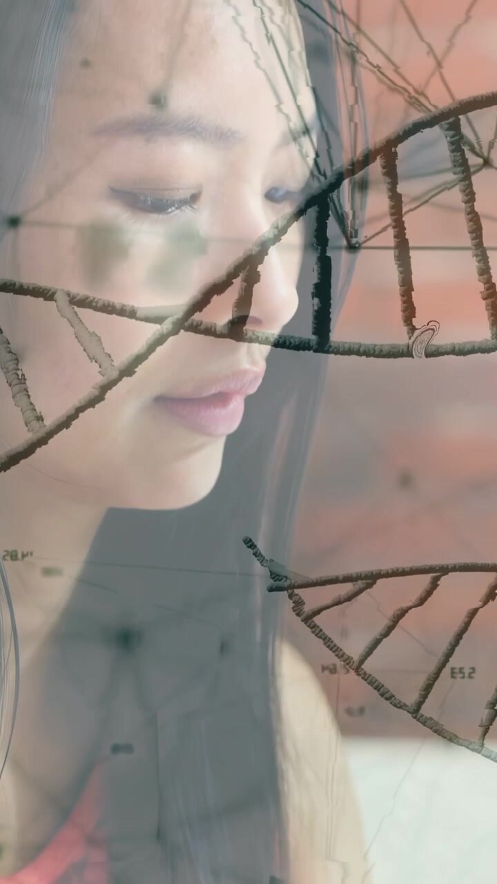 Vertical video: Woman lifting hand toward phone, reviewing health data with DNA helix overlaying