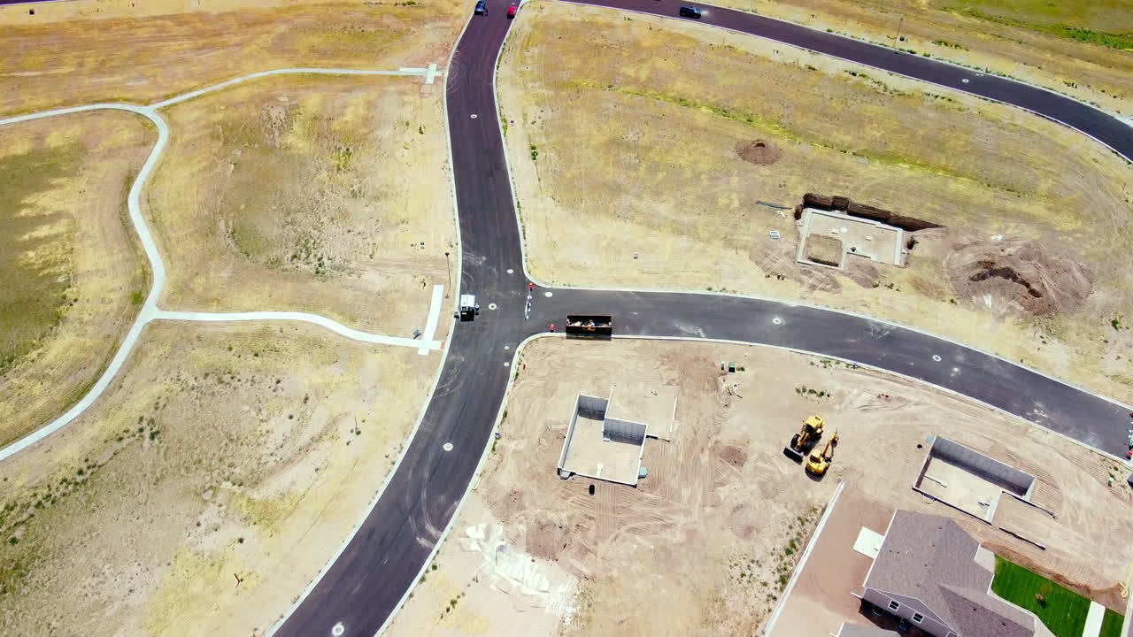 Fly over New Houses and Empty Lots in New Subdivision Construction