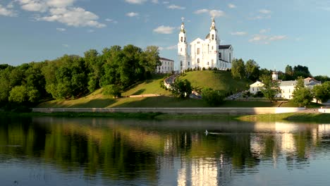 vitebsk, belarus. assumption cathedral church in upper town on uspensky mount hill and dvina river in sunny summer day