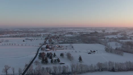 Dolly-Forward-Over-a-Snow-Covered-Countryside-Just-Before-Sunrise