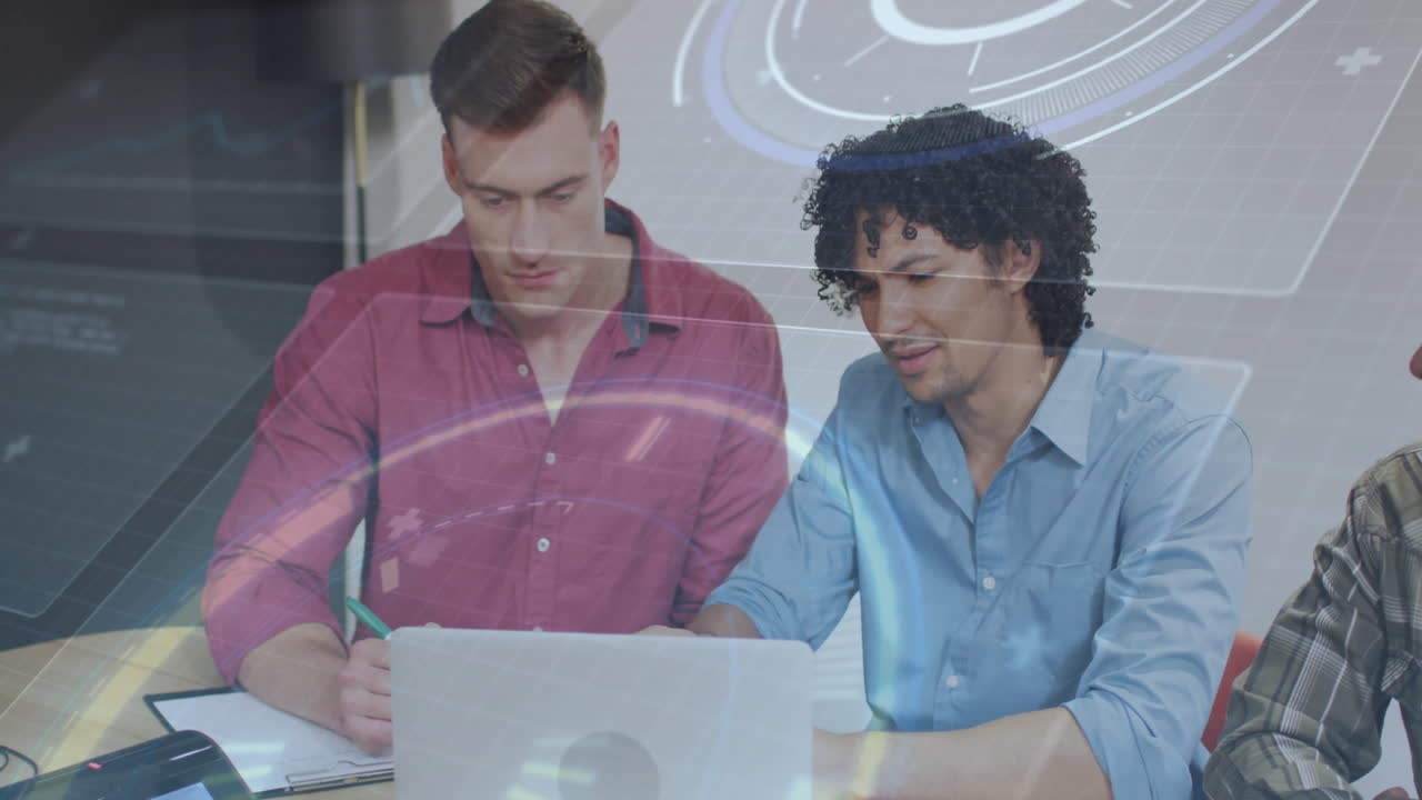 Two men collaborating on laptop with digital interface animation overlay