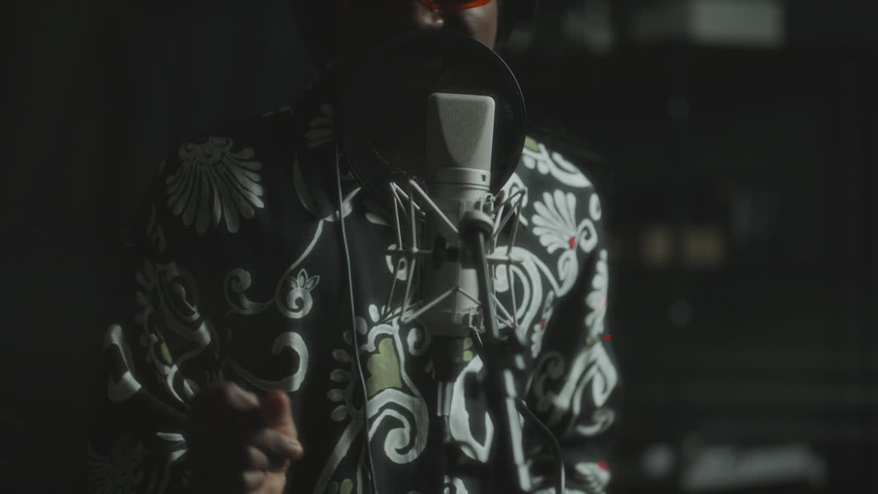 African American Performer Singing Emotionally in Professional Recording Studio