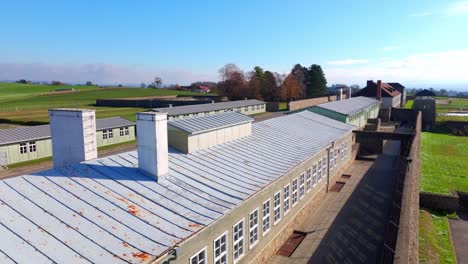 mauthausen concentration camp, austria - a glimpse of the facility's rooftop - drone flying forward