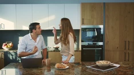 aggressive man arguing at kitchen. angry husband having conflict with wife.