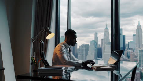 businessman working in a modern office with a city view
