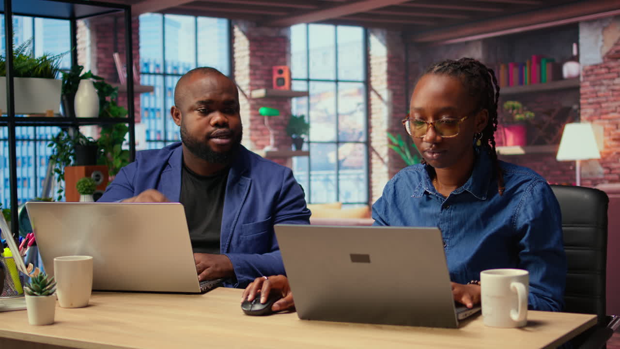 African American man and woman starting a fight at home office