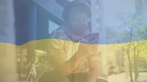 animation of flag of ukraine over biracial man using smartphone