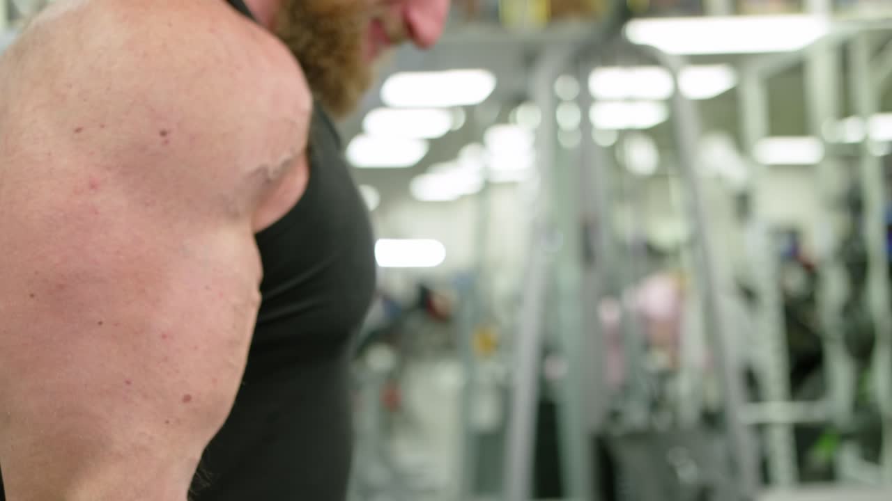 Muscular bodybuilder handsome men doing exercises in gym