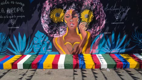 colorful painting on street wall and sidewalk in old town cartagena, colombia