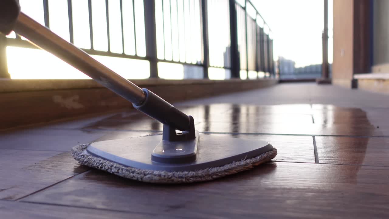 Mop cleaning a balcony