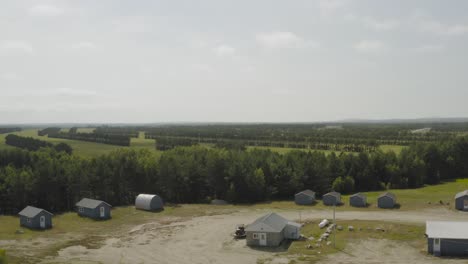 small idyllic holiday home glambing location by blueberry barrens, descending aerial