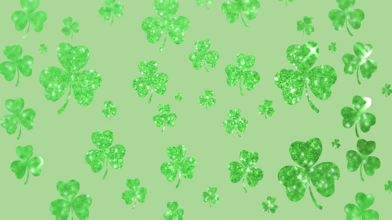 Animation of  shimmering green shamrocks falling