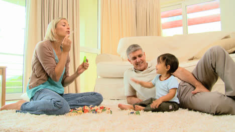 Young-parents-playing-with-baby