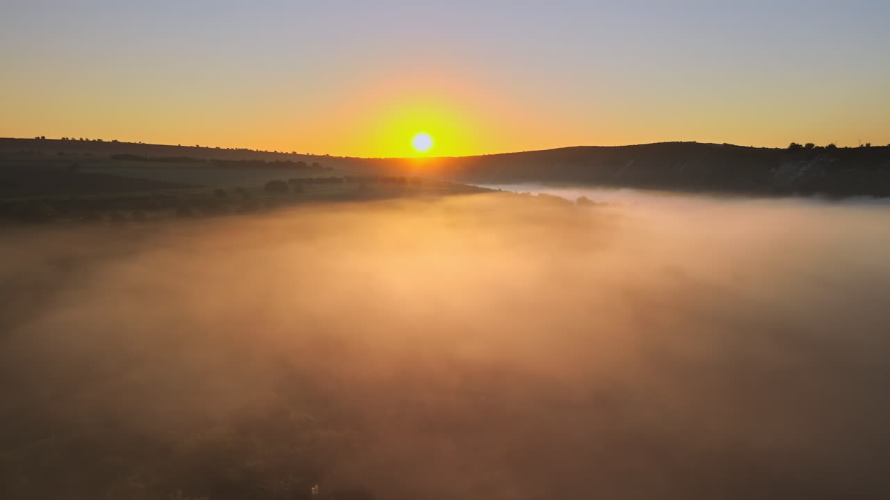 Aerial drone view of the Old Orhei at sunset. Valley with river and fog in Moldova