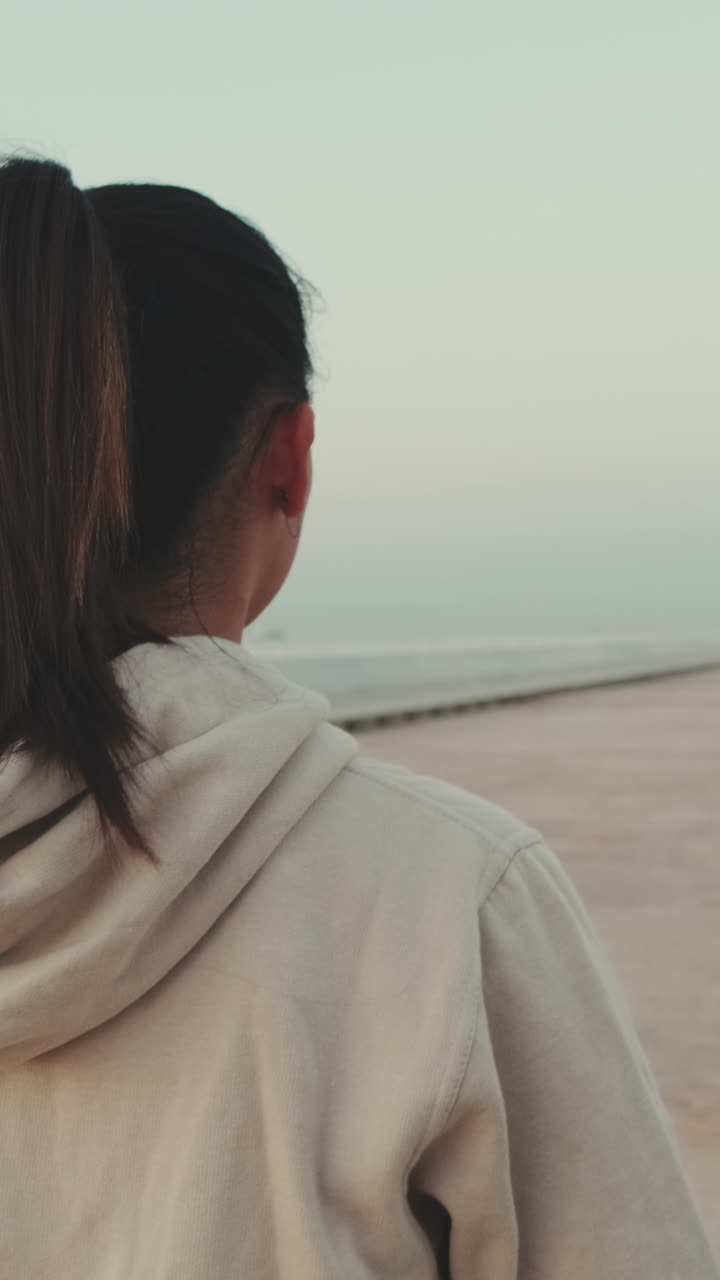 Woman looking out to the ocean