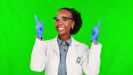 black woman, scientist and pointing up on green