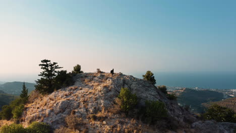 man climbs on the top of the mountain