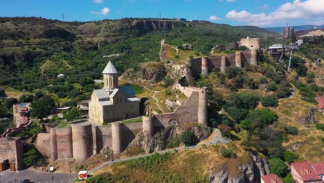 aerial: narikala fortress overlooking tbilisi capital city in georgia