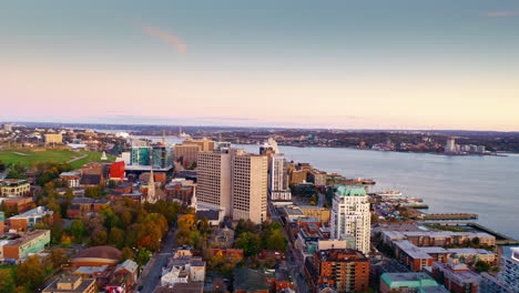 aerial drone shot over halifax downtown, nova scotia, canada.
high view of the cityscape, ocean and the urban buildings.