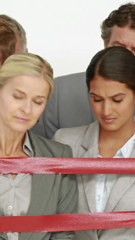 Business people surrounding by red strip