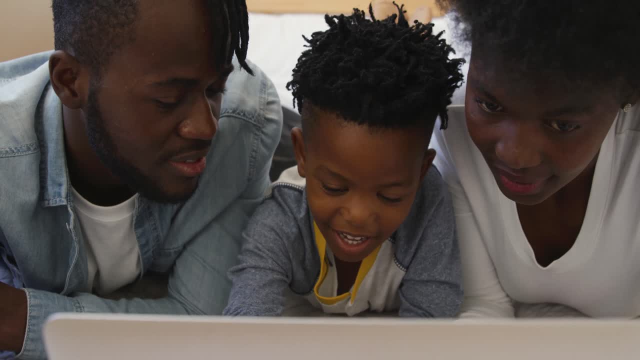 Family using laptop together at home