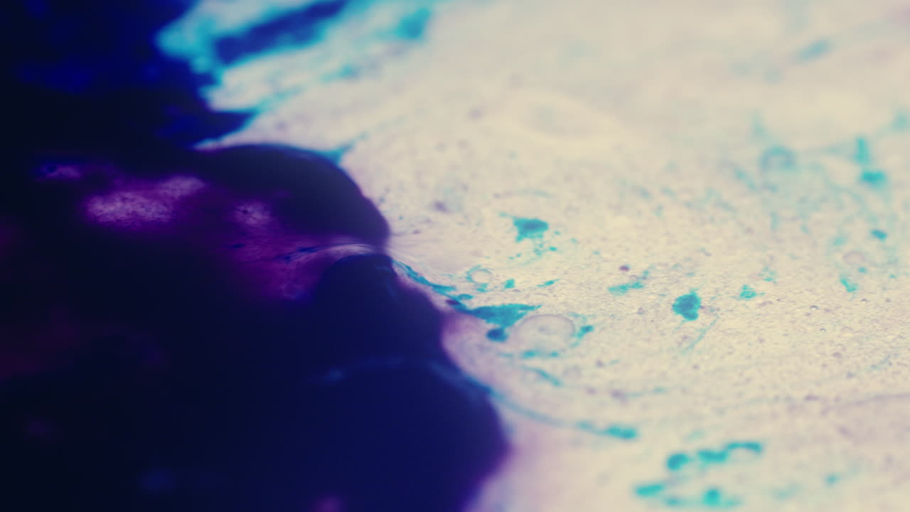 Colourful, organic, liquids macro shots buzzing and flowing