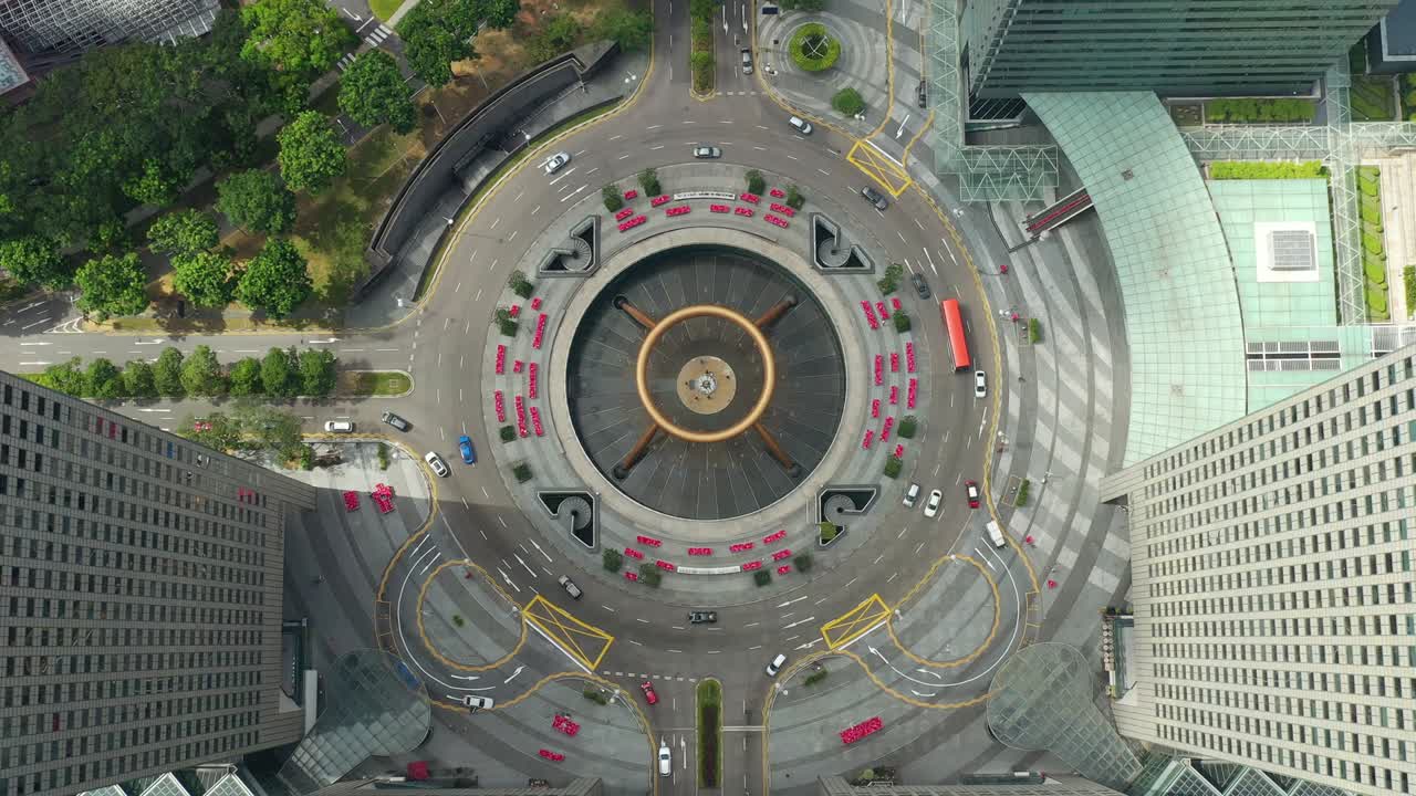 hora del día ciudad de singapur edificios famosos del centro del tráfico círculo cuadrado panorama aéreo 4k