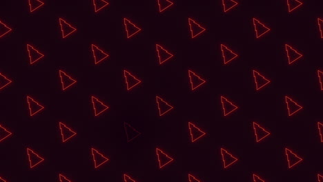un árbol de navidad rojo neón sobre un fondo negro.