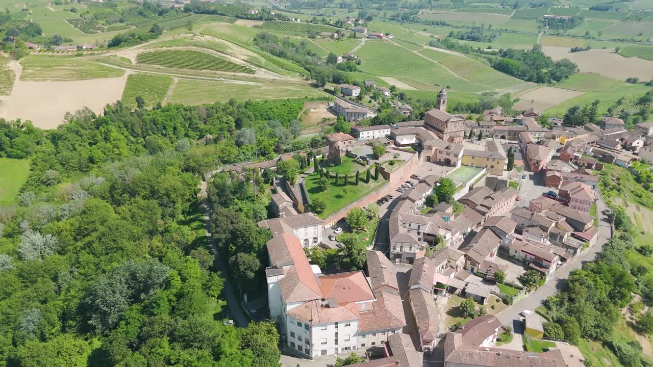 Castelnuovo Calcea, Monferrato region, Asti, Piedmont, Italy. 4k aerial view of the city. Langhe-Roero and Monferrato. Circling to the left around the city and natural landscape.