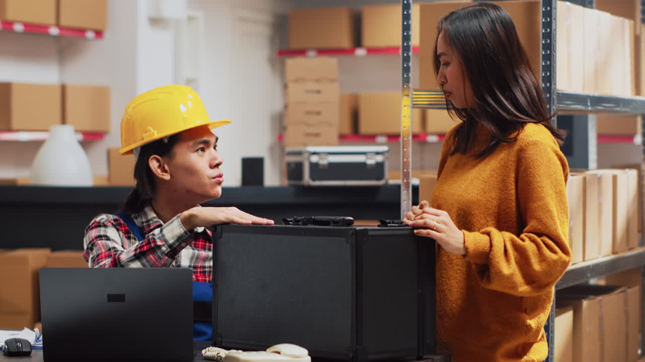 Warehouse workers discussing a case
