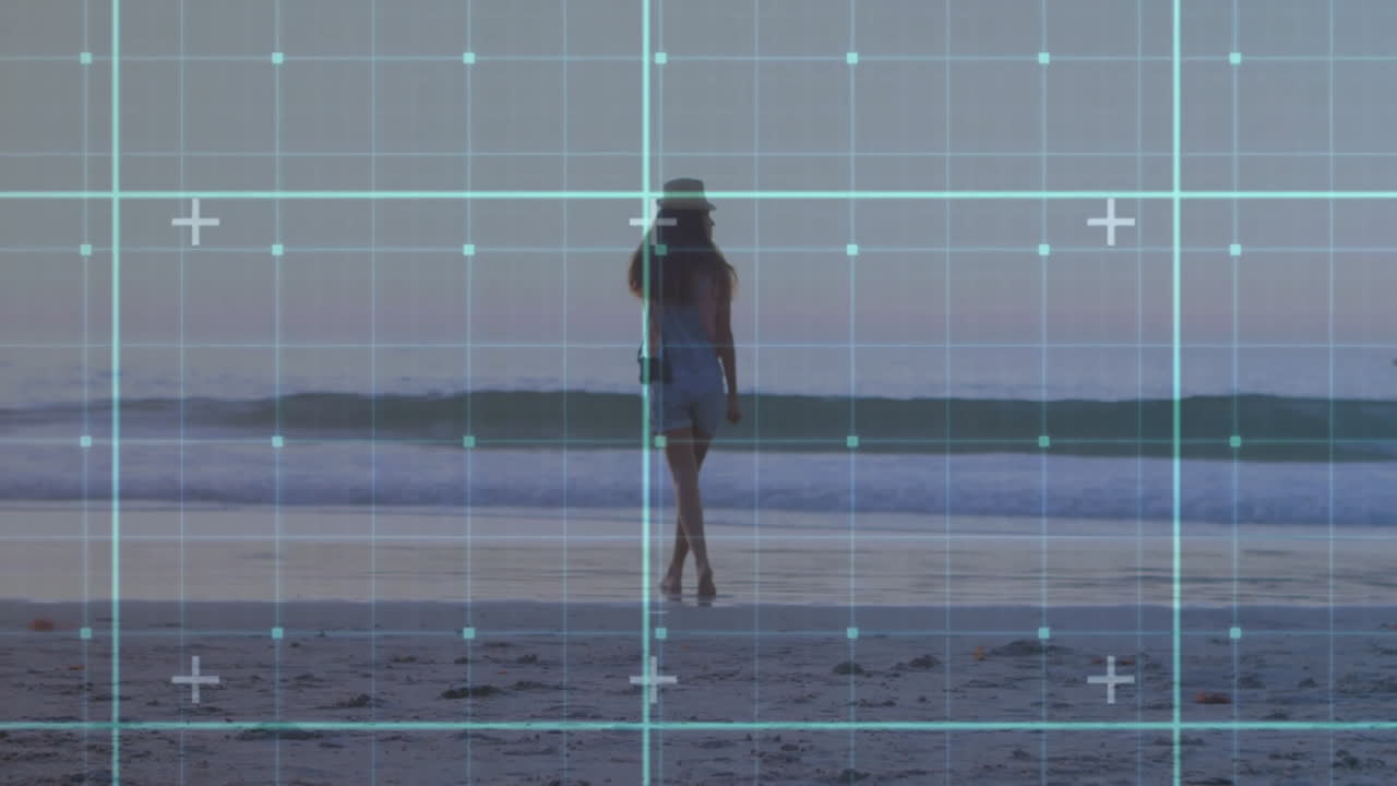 Walking on beach, woman interacting with digital grid animation overlay