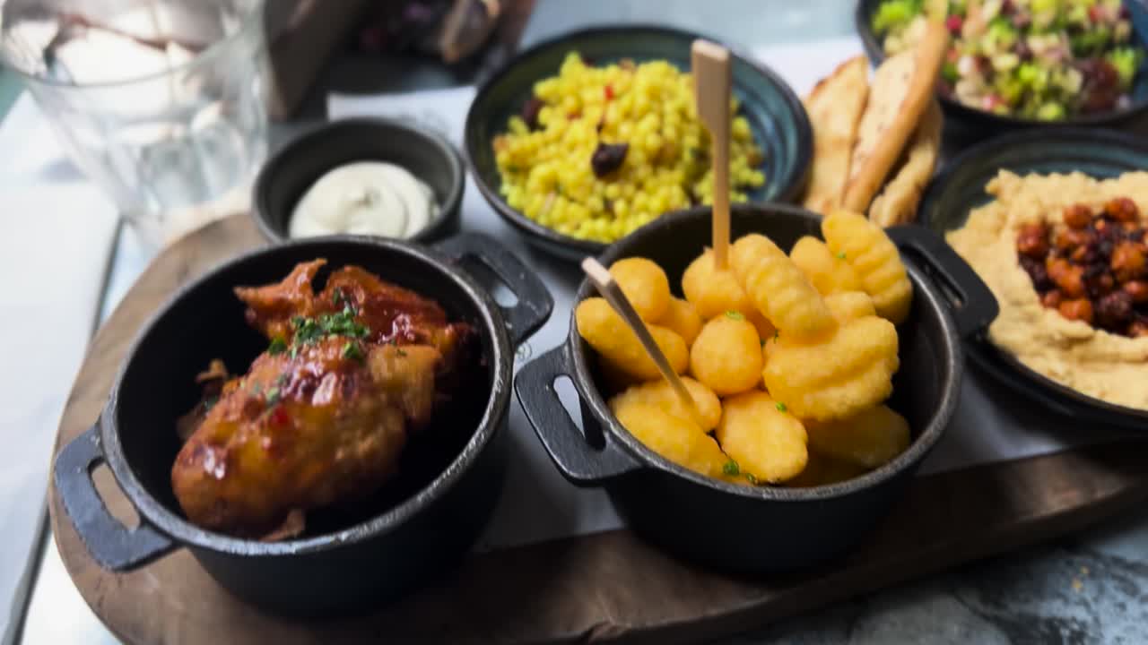 Vegan Appetizer Small Plates Board with Salad Fries Hummus