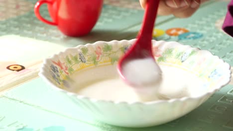 child eating porridge