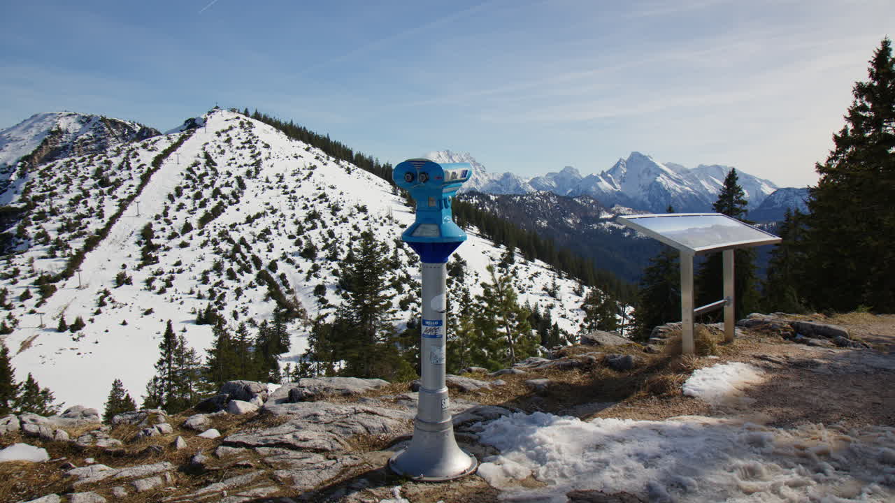 Bavarian Alps Viewpoint With Blue Binocular Viewer In Berchtesgaden, Bavaria, Germany. wide shot