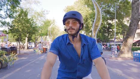 young man riding a bike.
