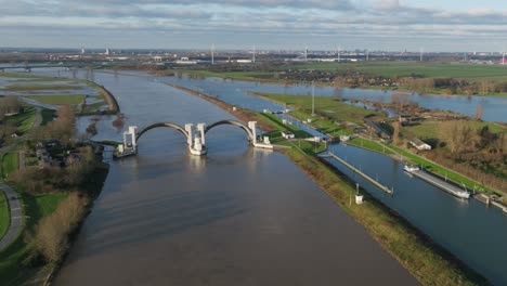 aerial view of the flooding near hagestein dam and lock complex is located on the lek near the village of hagesteinand has a weir, a lock, a fish ladder and a hydroelectric power station