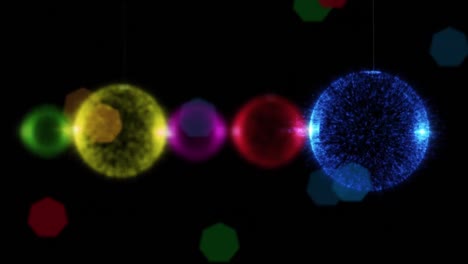 animation of christmas baubles and christmas fairy lights flickering over black background