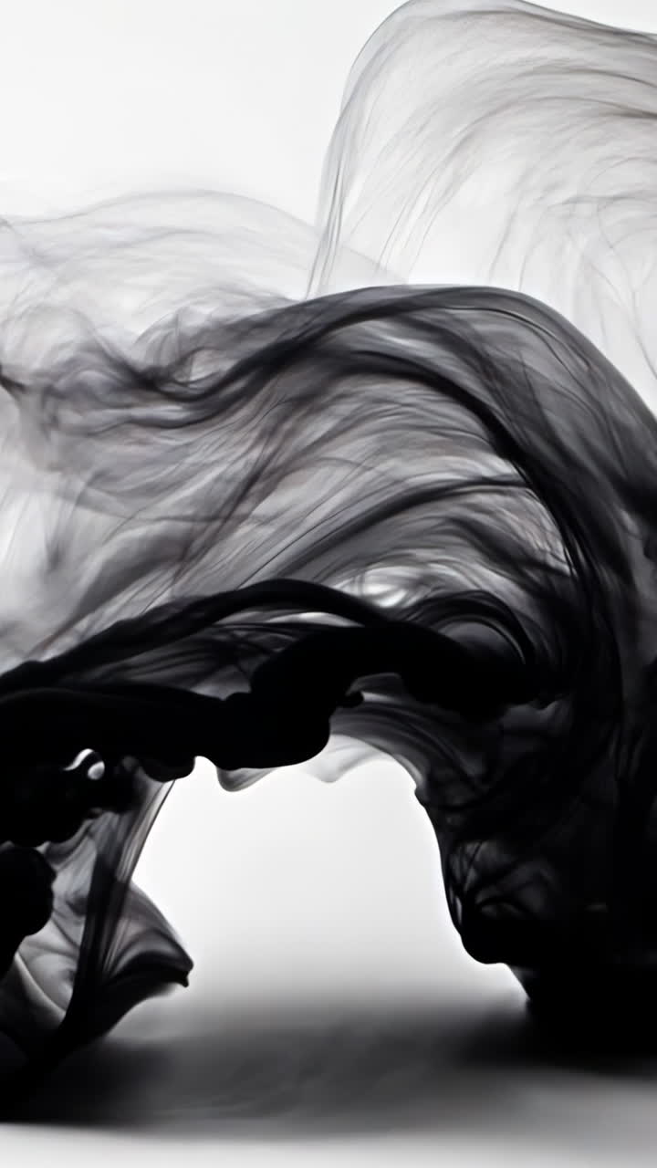 A black smoke trail is shown in the air. The smoke is thick and dark, and it seems to be coming from a fire. Concept of danger and destruction, as the smoke is a clear indication of a fire