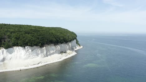 Drone-Aerial-Shot-of-the-chalk-cliffs-on-Ruegen-Rügen-in-Germany-in-beautiful-light-with-green-and-blue-seawater,-Europe