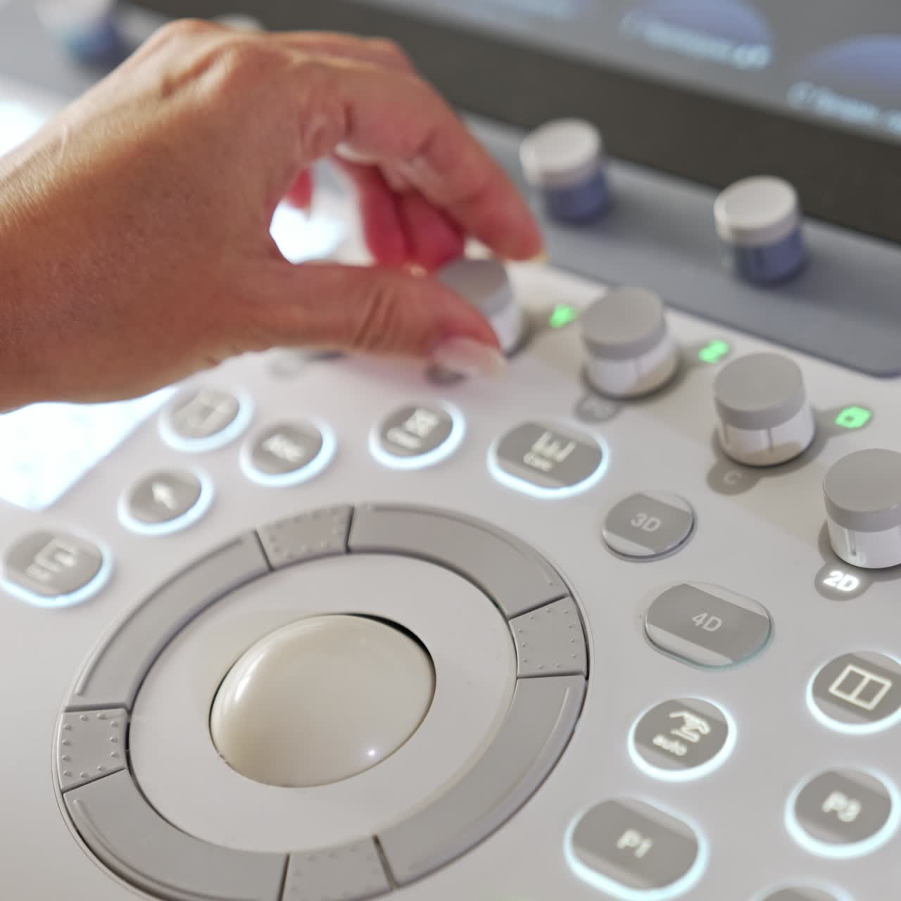 Physician's hand pressing the buttons on the keyboard of ultrasound machine. Close up. Advanced equipment for ultrasonic diagnostics in clinics